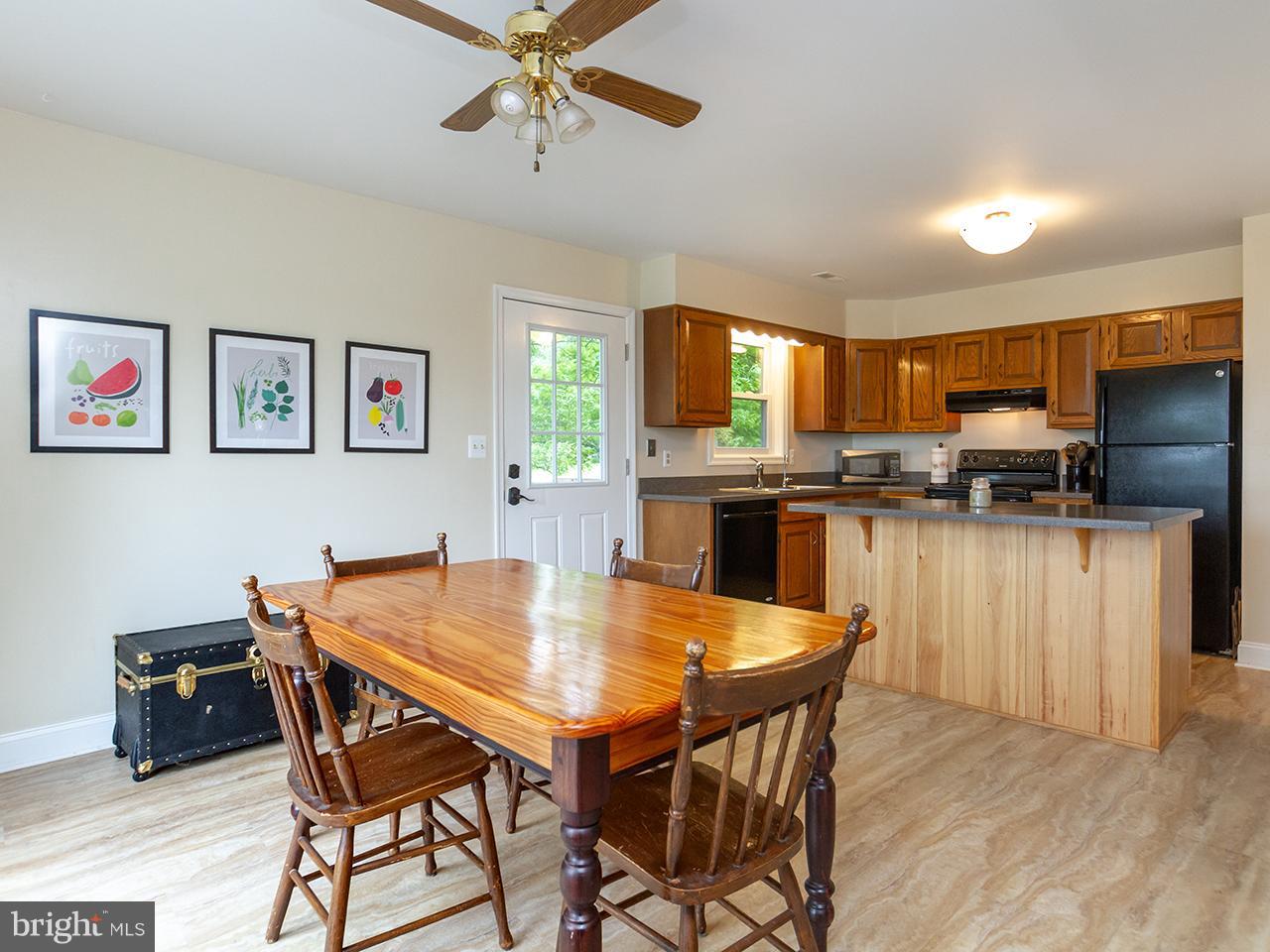 17521 Troyer Road Monkton, MD 21111 - Photo 8 of 29 a view of a dining room with furniture and a kitchen