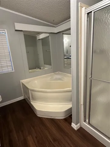 a bathroom with a bathtub and a shower