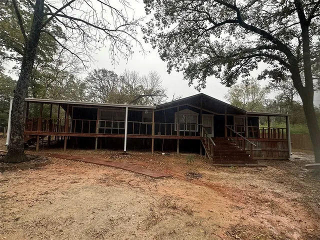 a house with trees in the background