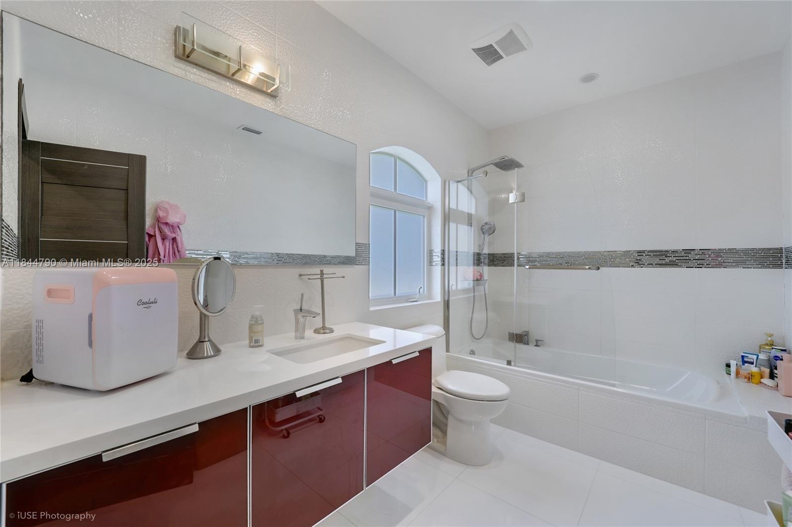 5320 Sunset Drive Miami, FL 33143 - Photo 22 of 45 a bathroom with a sink a toilet and shower