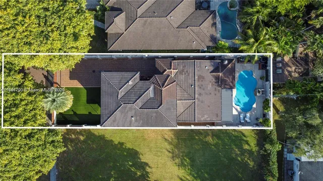 an aerial view of residential house with outdoor space
