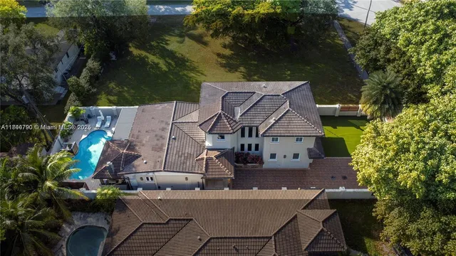 an aerial view of a house with a garden