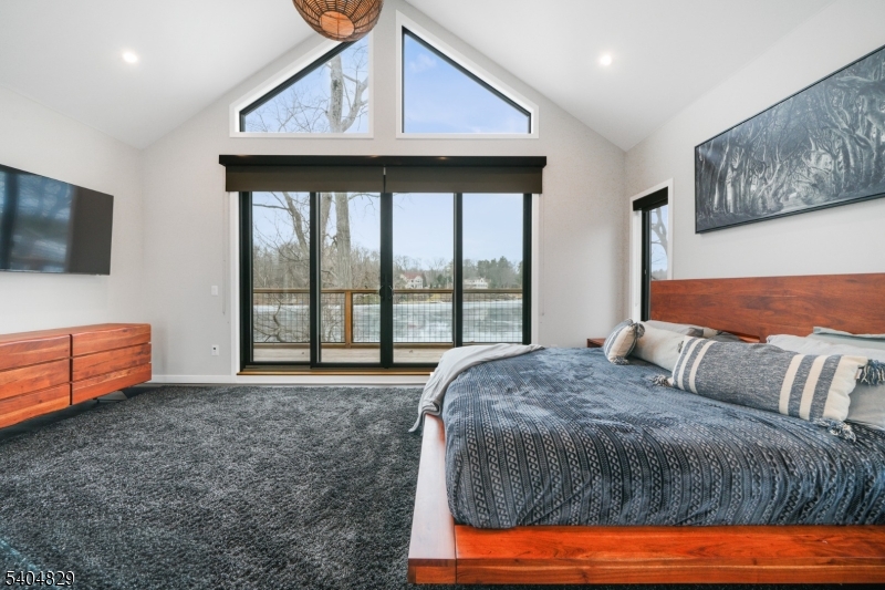 71 Witte Road West Milford, NJ 07421 - Photo 17 of 42 a bedroom with a bed and large window