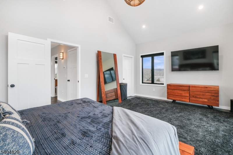 71 Witte Road West Milford, NJ 07421 - Photo 21 of 42 a bedroom with furniture and a flat screen tv