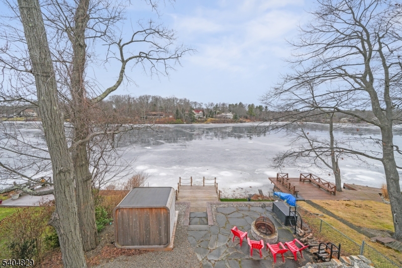 71 Witte Road West Milford, NJ 07421 - Photo 32 of 42 a view of a lake with a mountain in the background