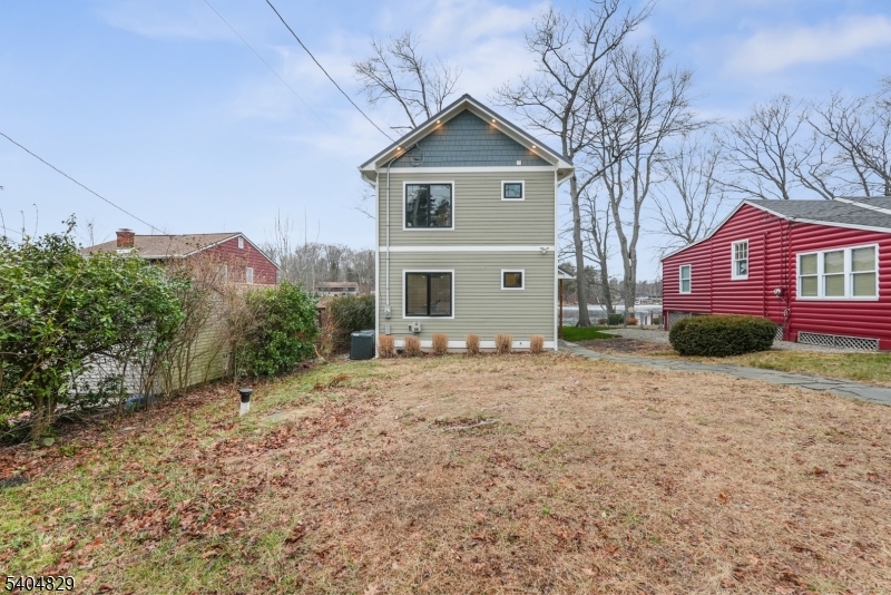 71 Witte Road West Milford, NJ 07421 - Photo 39 of 42 a front view of a house with a yard and garage