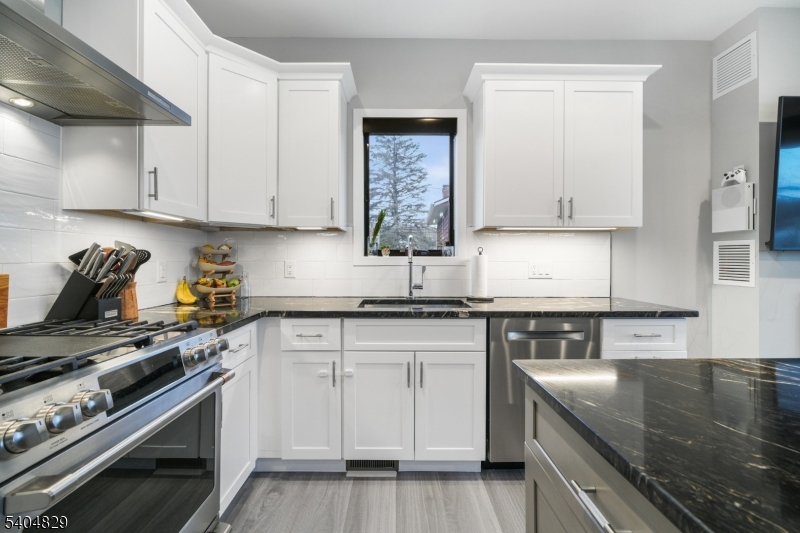 71 Witte Road West Milford, NJ 07421 - Photo 4 of 42 a kitchen with granite countertop a stove sink and cabinets