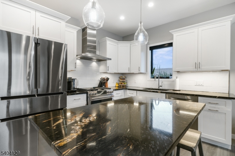 71 Witte Road West Milford, NJ 07421 - Photo 5 of 42 a kitchen with stainless steel appliances granite countertop a sink refrigerator and microwave