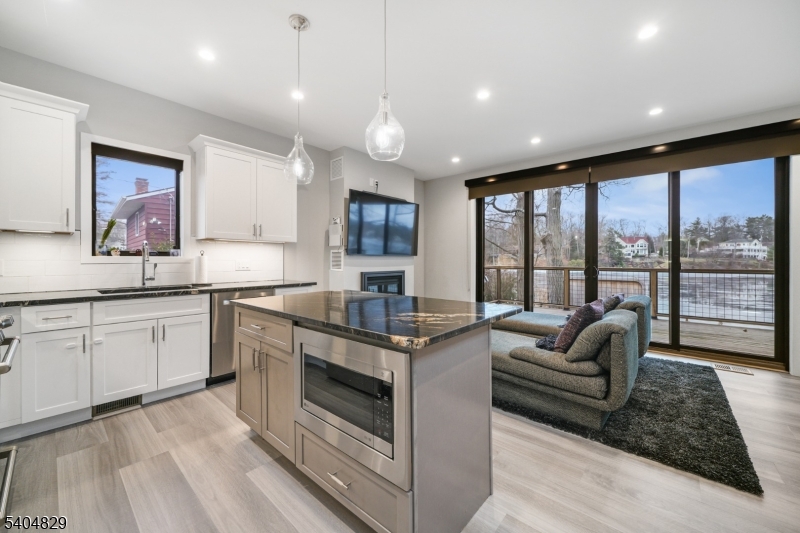 71 Witte Road West Milford, NJ 07421 - Photo 7 of 42 a open kitchen with stainless steel appliances granite countertop a stove and cabinets