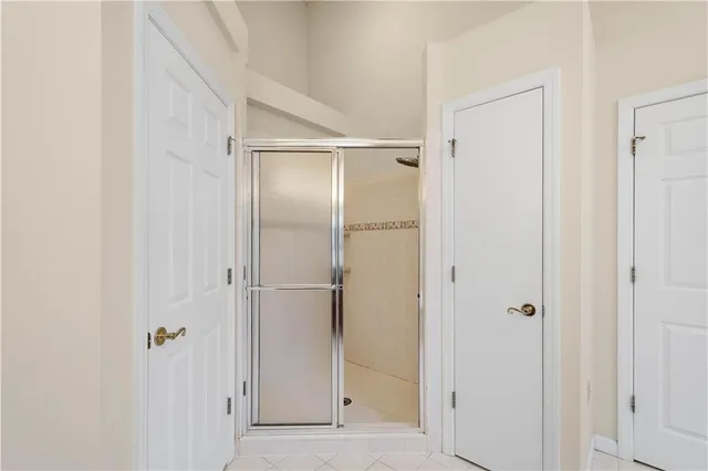 a view of bathroom with a glass shower door