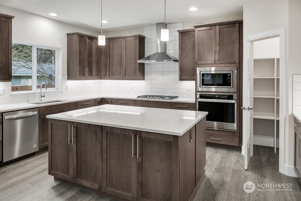 4012 171st Place Southeast Bothell, WA 98012 - Photo 13 of 28 a kitchen with a sink stove and refrigerator