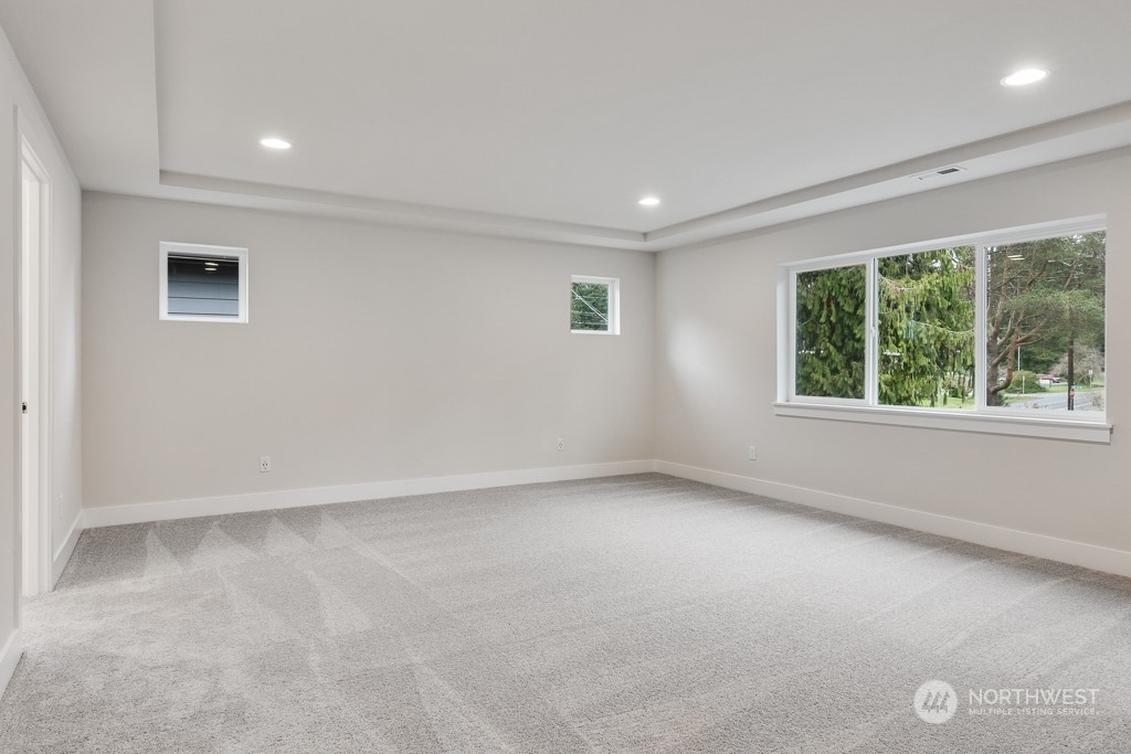 4012 171st Place Southeast Bothell, WA 98012 - Photo 16 of 28 an empty room with windows