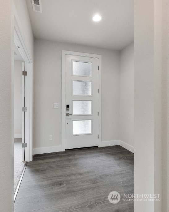 4012 171st Place Southeast Bothell, WA 98012 - Photo 2 of 28 an empty room with wooden floor
