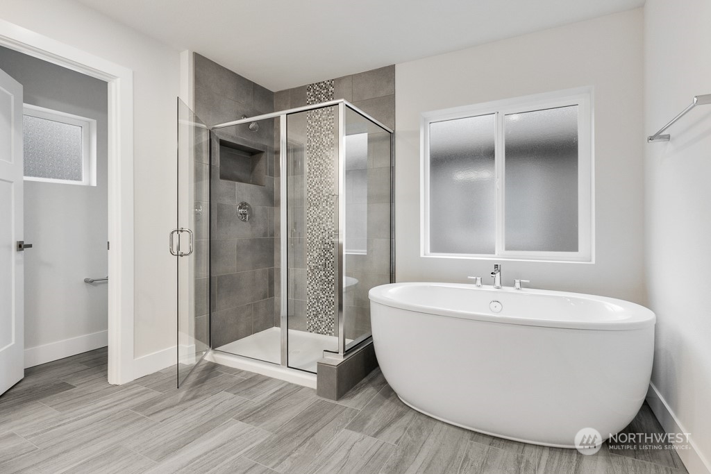 4012 171st Place Southeast Bothell, WA 98012 - Photo 21 of 28 a spacious bathroom with a bathtub and shower