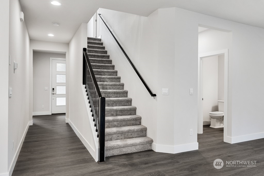 4012 171st Place Southeast Bothell, WA 98012 - Photo 7 of 28 a view of a hallway with wooden floor and entryway