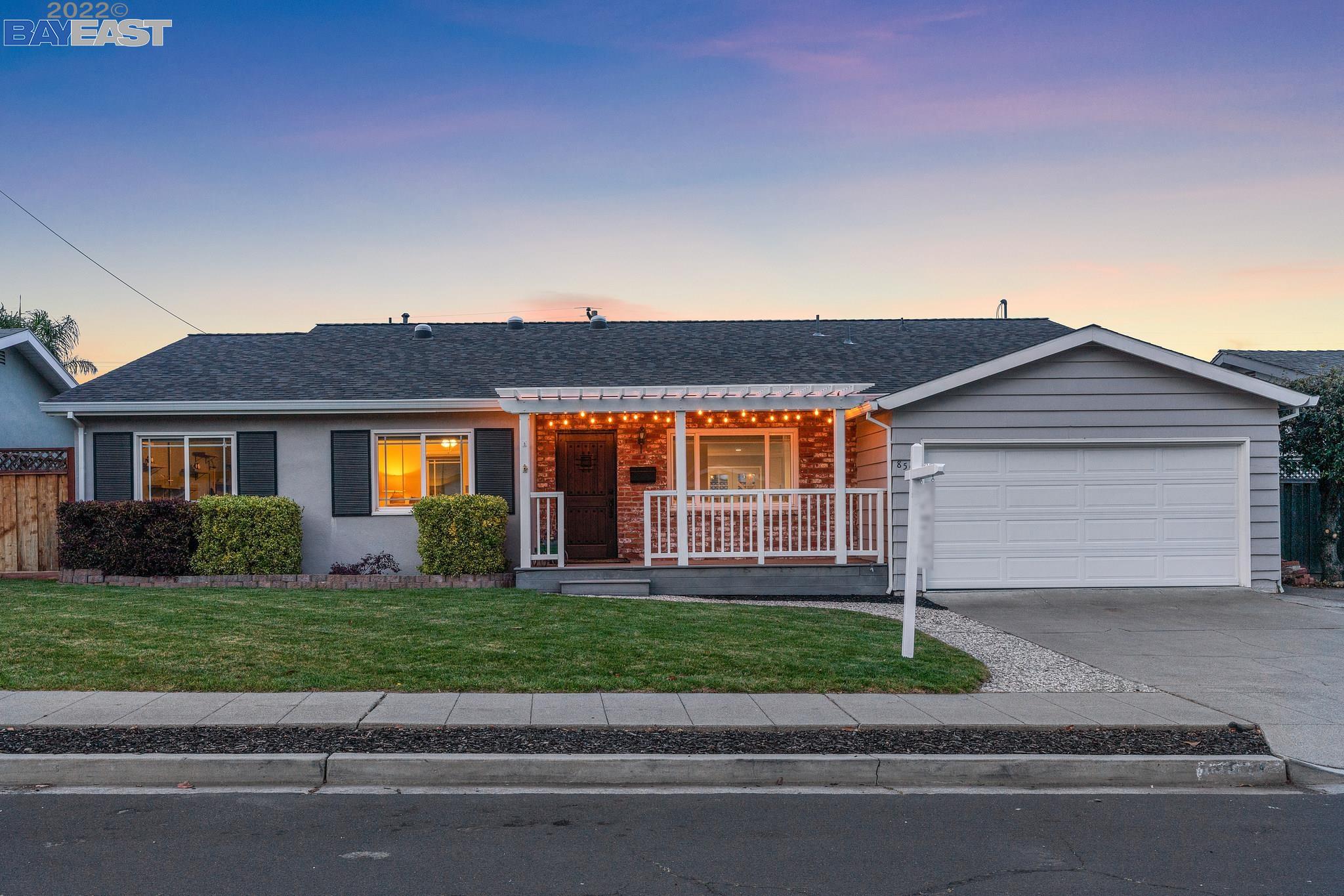8557 Valencia Street Dublin, CA 94568 - Photo 1 of 1 a front view of a house with a yard and garage