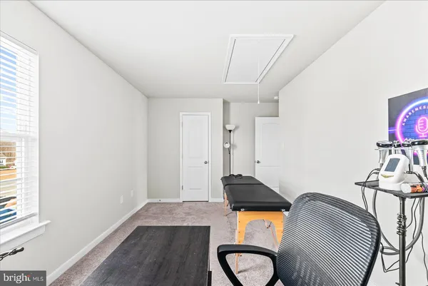 a bedroom with bed and a window