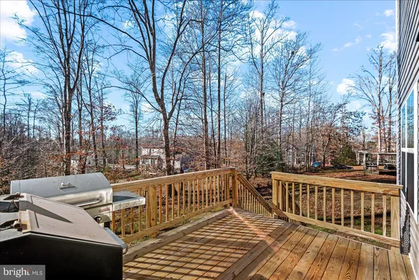 a view of deck with wooden floor and outdoor seating