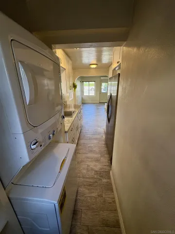 a view of a hallway with furniture