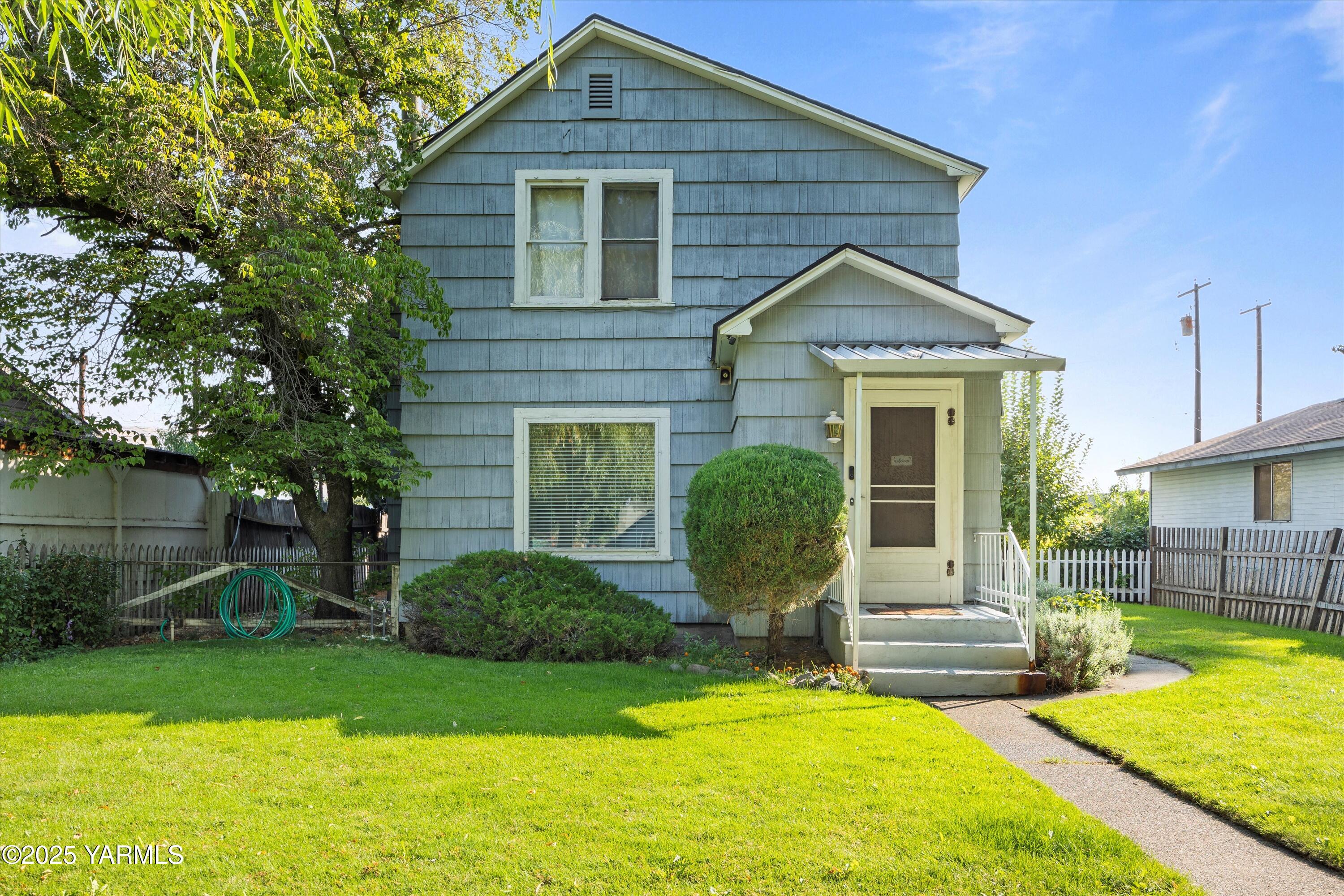 305 South 9th Street Yakima, WA 98901 - Photo 1 of 43 a view of a house with a yard patio and swimming pool