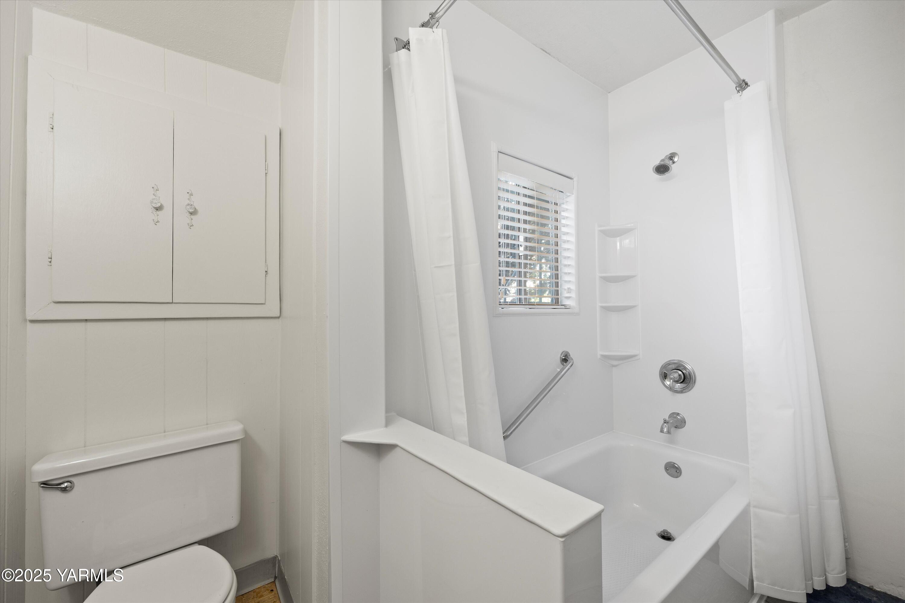 305 South 9th Street Yakima, WA 98901 - Photo 26 of 43 a white toilet sitting next to a bathroom sink