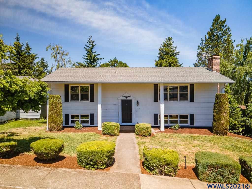 1278 Southwest Maple Street Dallas, OR 97338 - Photo 1 of 42 a front view of a house with swimming pool