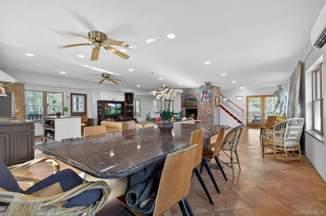 a dining room with furniture and wooden floor