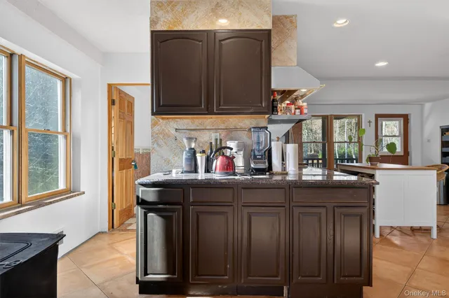 a kitchen with wooden cabinets and sink