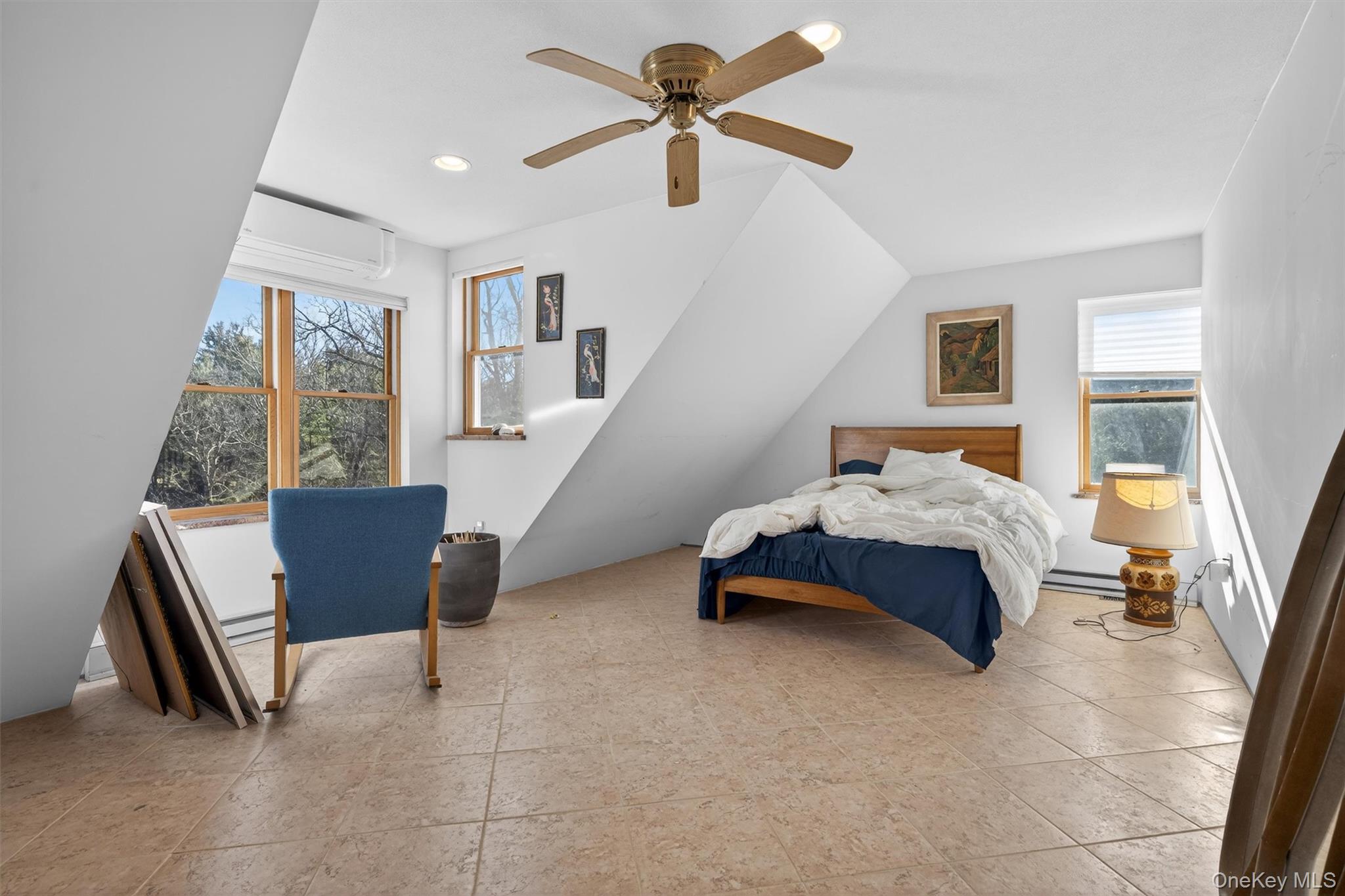 125 Dexheimer Road Narrowsburg, NY 12764 - Photo 25 of 50 Bedroom with a ceiling fan, multiple windows, and lofted ceiling