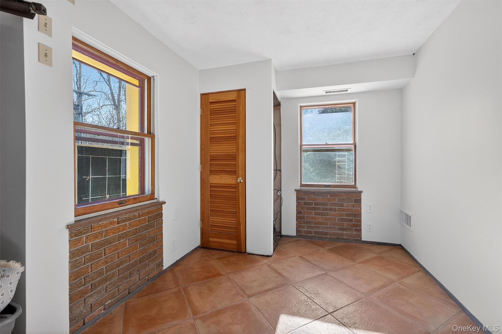 125 Dexheimer Road Narrowsburg, NY 12764 - Photo 36 of 50 Unfurnished bedroom with a closet and brick wall
