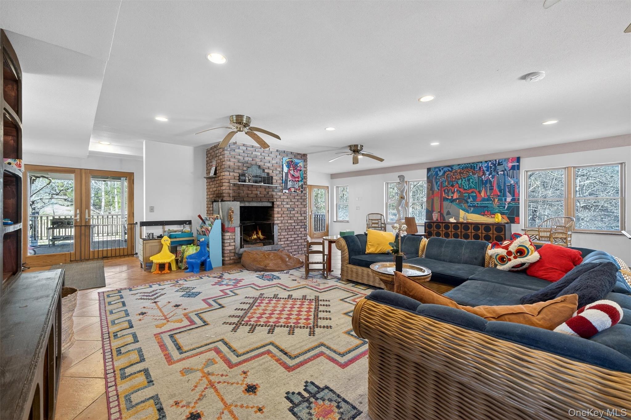 125 Dexheimer Road Narrowsburg, NY 12764 - Photo 5 of 50 Tiled living area featuring a brick fireplace, plenty of natural light, recessed lighting, and a ceiling fan