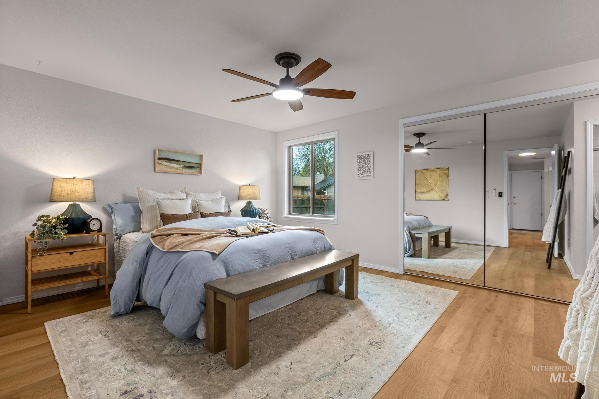 4745 North Oxbow Place Boise, ID 83713 - Photo 21 of 38 Bedroom featuring a closet, a ceiling fan, and light wood-style floors