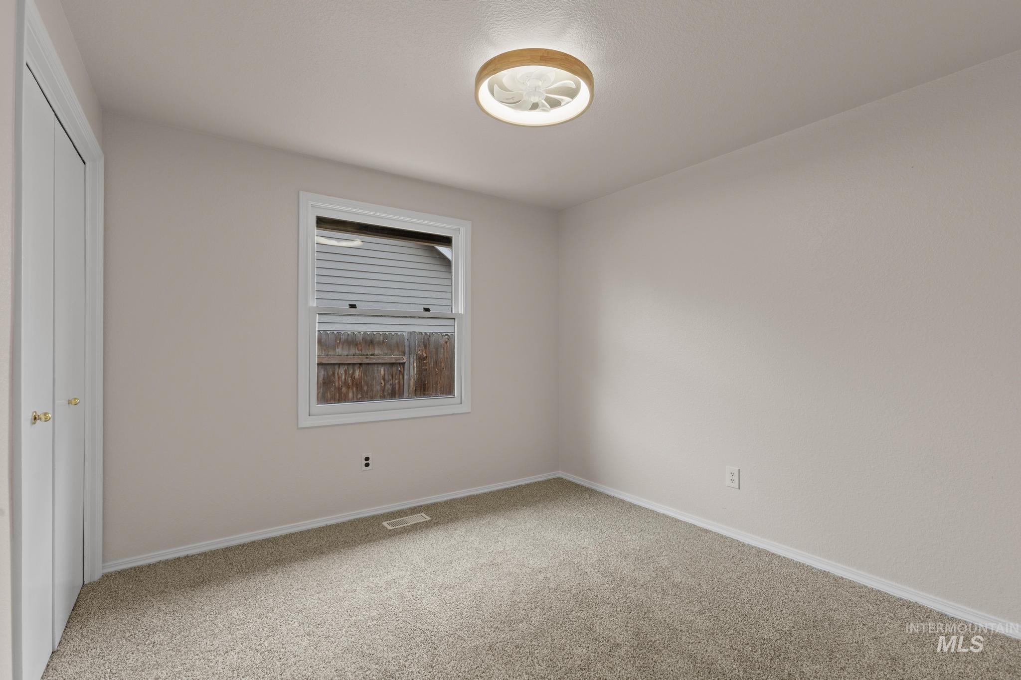4745 North Oxbow Place Boise, ID 83713 - Photo 30 of 38 Unfurnished bedroom featuring a closet and light carpet