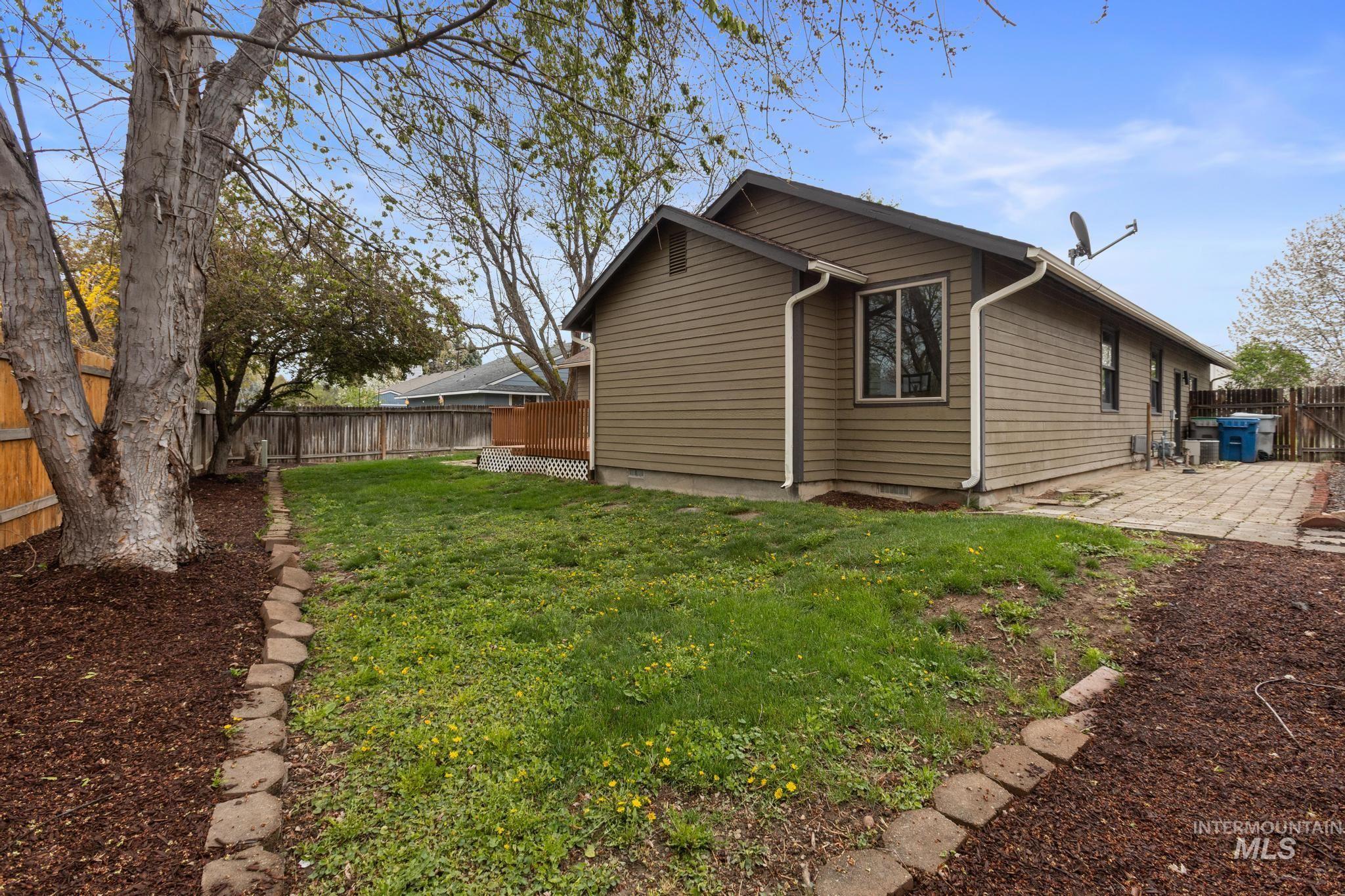 4745 North Oxbow Place Boise, ID 83713 - Photo 36 of 38 View of side of property featuring a fenced backyard and a patio