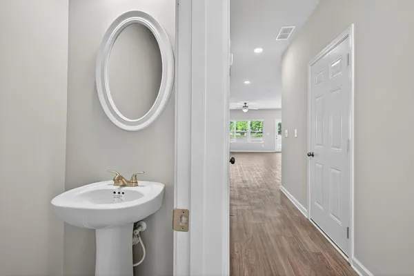 a view of a hallway with white walls