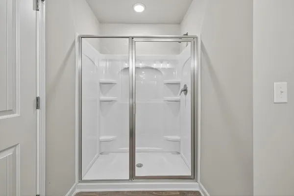 a view of a bathroom with a sink and refrigerator