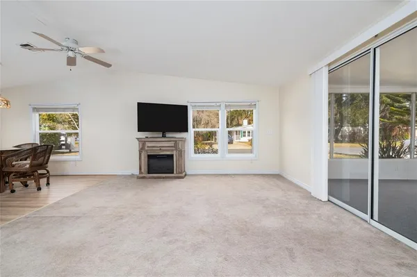 an empty room with furniture and a fireplace