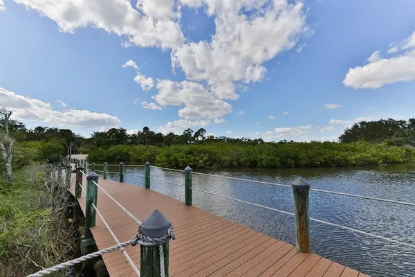 a terrace with outdoor seating and lake view