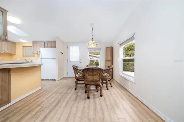 a dining room with furniture and window