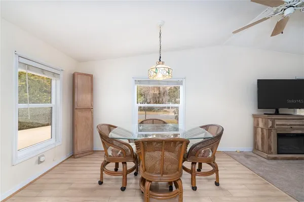 a dining room with furniture window wooden floor
