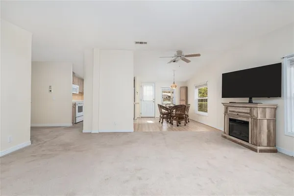 a view of a livingroom with furniture and a flat screen tv