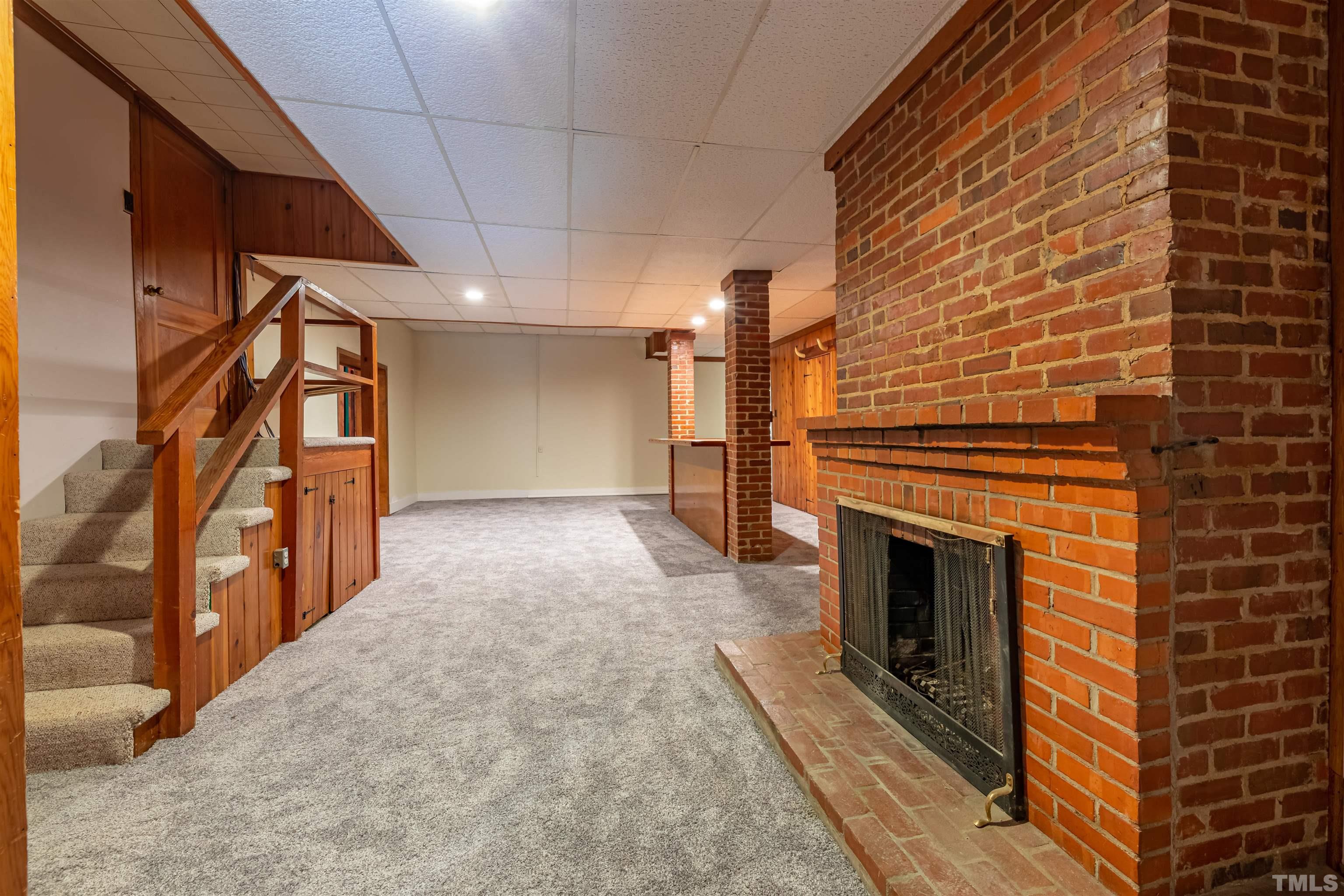 1511 Duplin Road Raleigh, NC 27607 - Photo 17 of 23 a view of a hallway with wooden floor and staircase
