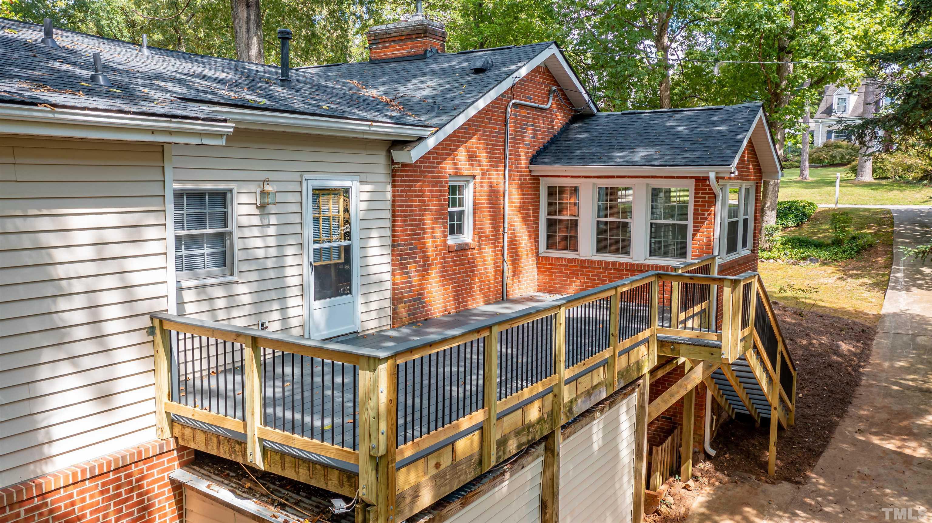 1511 Duplin Road Raleigh, NC 27607 - Photo 19 of 23 a view of a house with backyard and deck
