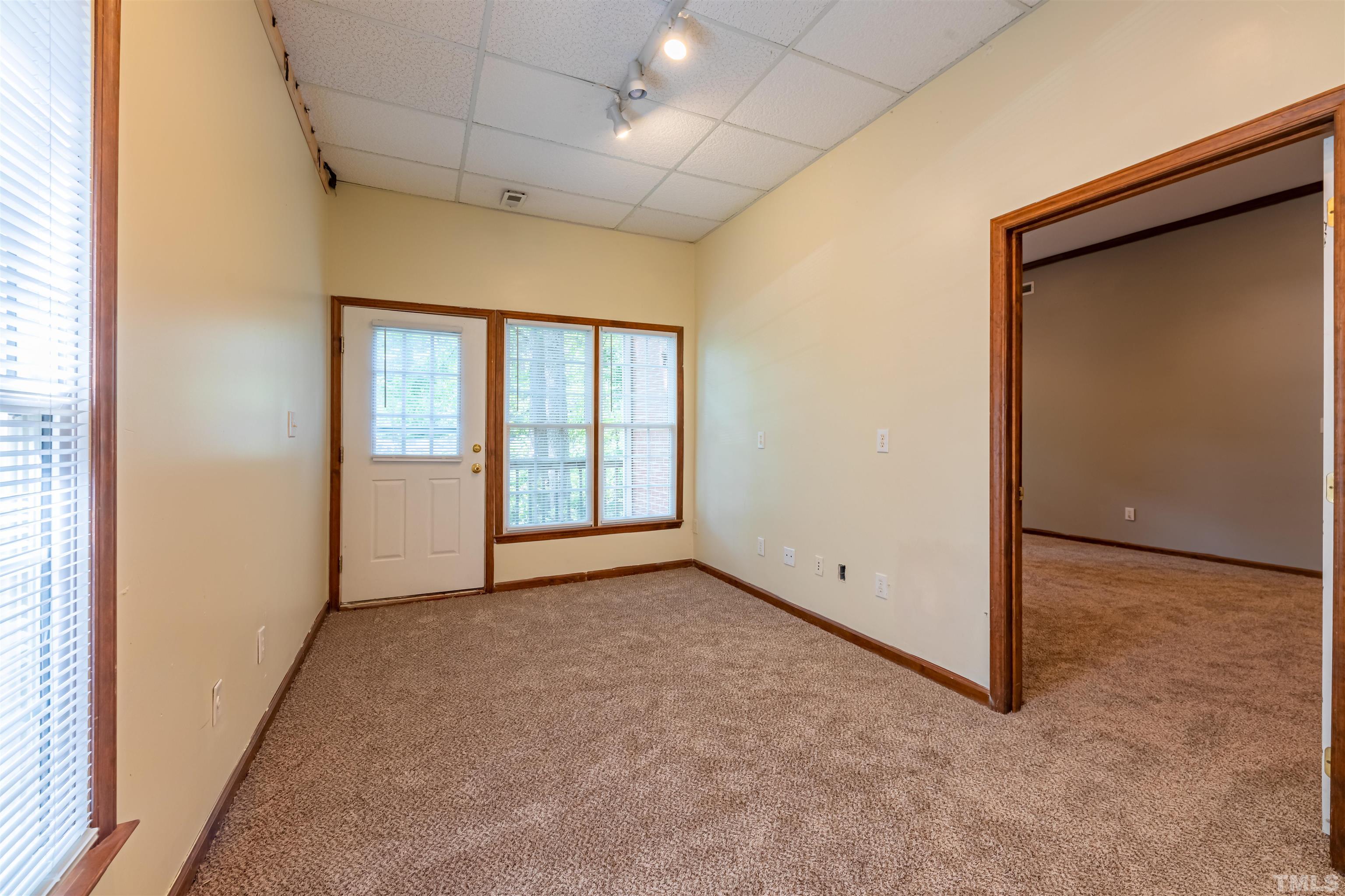 1511 Duplin Road Raleigh, NC 27607 - Photo 21 of 23 an empty room with windows