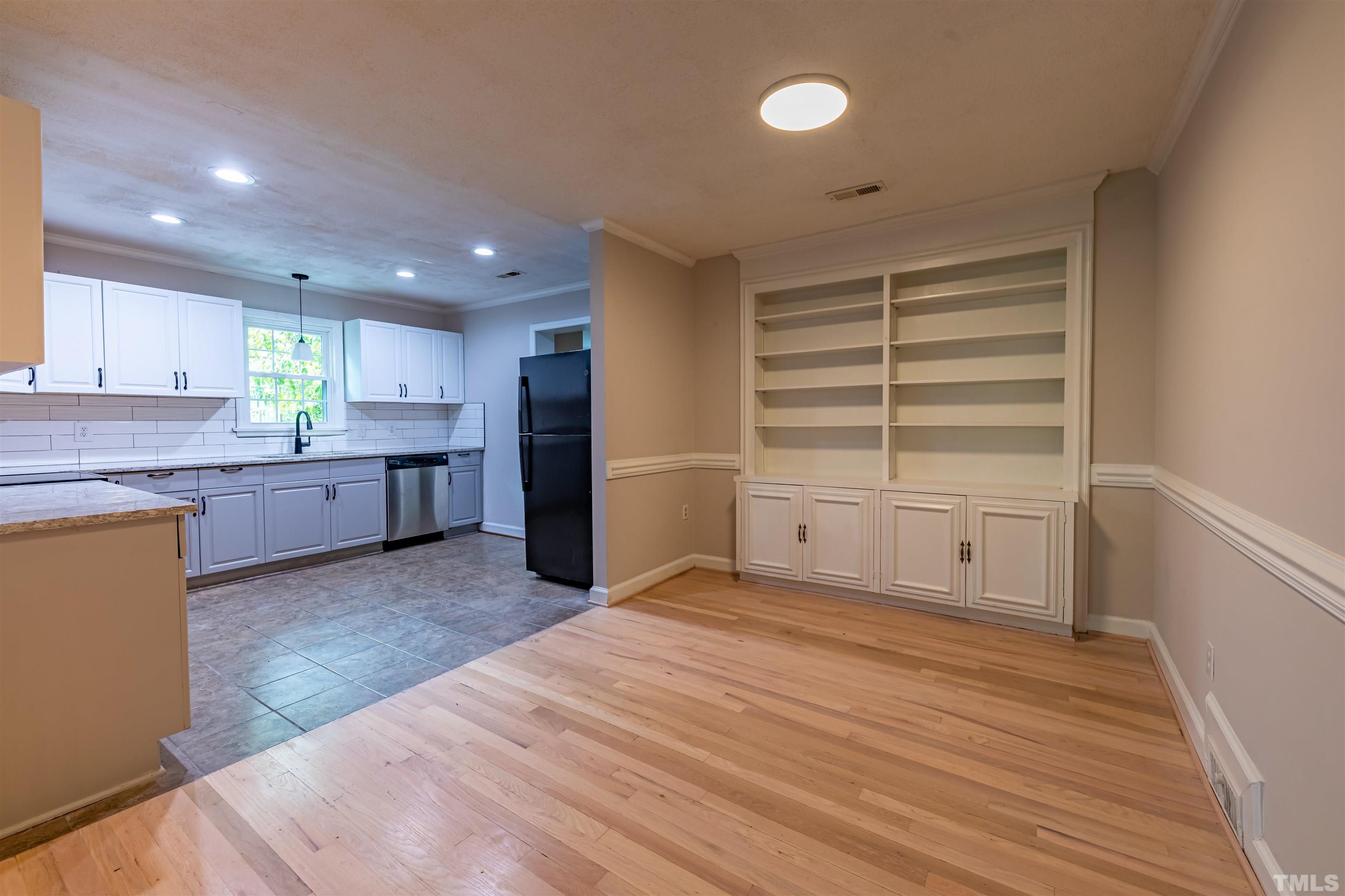 1511 Duplin Road Raleigh, NC 27607 - Photo 5 of 23 a view of a kitchen with microwave and cabinets