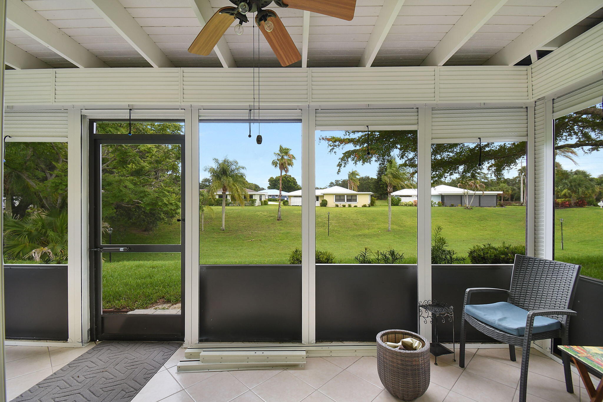 5251 Southeast Sea Island Way Stuart, FL 34997 - Photo 29 of 68 a view of a porch with furniture and garden