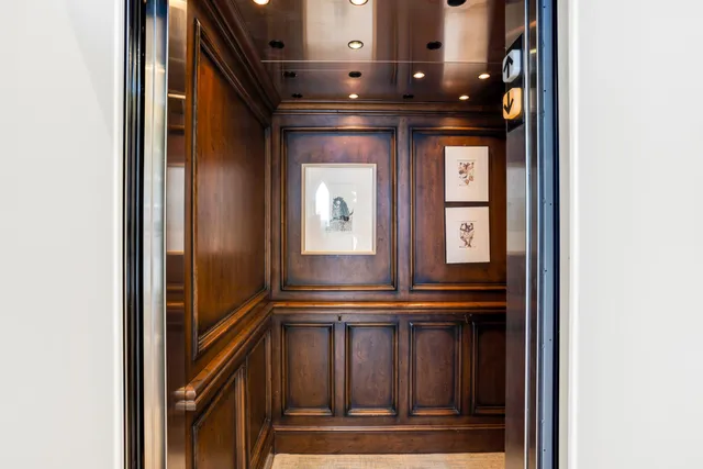 a living room with fireplace furniture or chandelier and a rug
