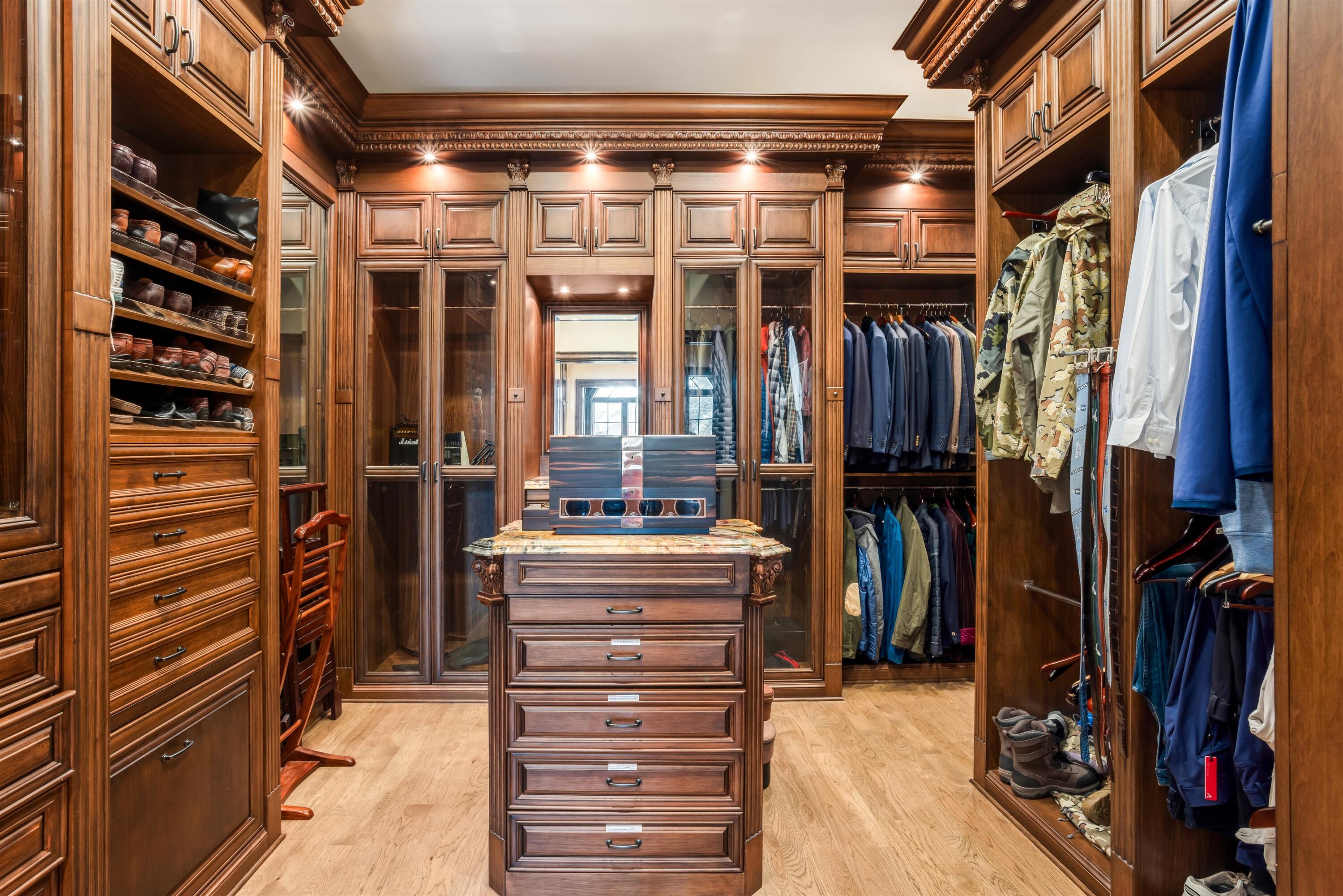 799 Northeast 45th Road Boca Raton, FL 33431 - Photo 43 of 90 a view of walk in closet with clothes and shoes