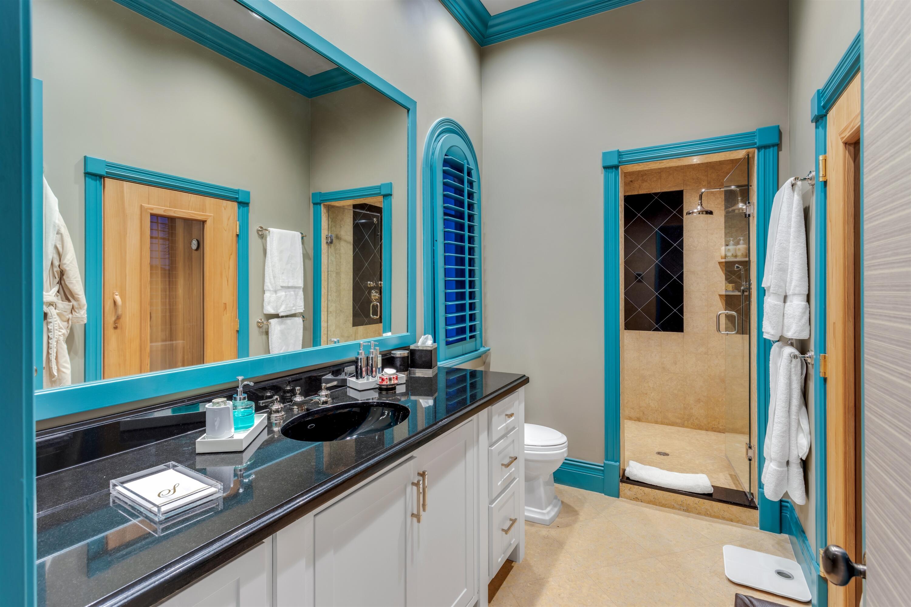 799 Northeast 45th Road Boca Raton, FL 33431 - Photo 54 of 90 a bathroom with a sink a toilet and a mirror