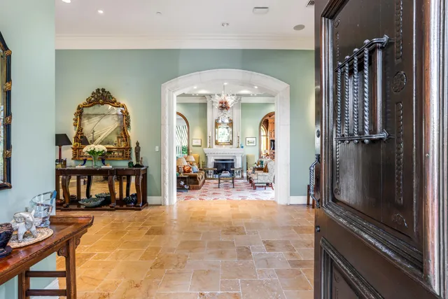 a view of a dining room with furniture wooden floor and chandelier